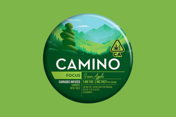 Close-up of a tin of Camino Green Apple Gummies, featuring a colorful label with green apple graphics, set against a clean background.