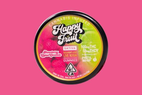 Close-up of a tin of Happy Fruit Strawberry Lifted Limeade gummies, featuring a colorful label with a strawberry and lime design, set against a neutral background.